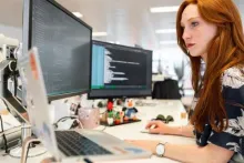 Women working at a desktop computer