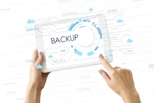 Person holding a tablet with backup image